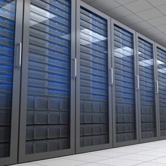 Hallway with row of tower servers in data centre